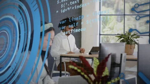 Developer adjusting headset on call, typing on tablet fixing bug, code UI rings Stock Footage 333287450