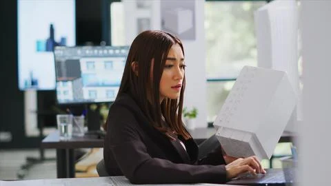 Developer analyzing 3d building model at realty office Stock Photos