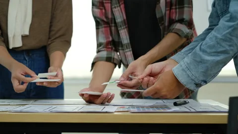 Developer and ux designer brainstorming and working on mobile app interface Stock Footage 245410611