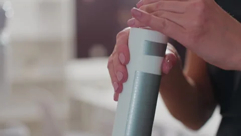 Developer bottle display, stylist demonstrating product application Stock Footage 326105386