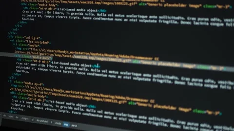 Developer is browsing html code on the computer screen. HTML Web Page Code Stock Footage 141018351