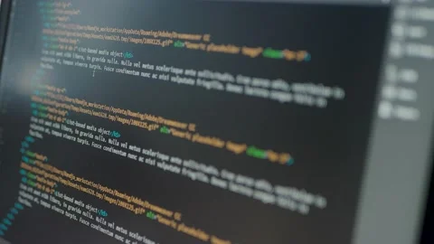 Developer is browsing html code on the computer screen. HTML Web Page Code Stock Footage 141018375
