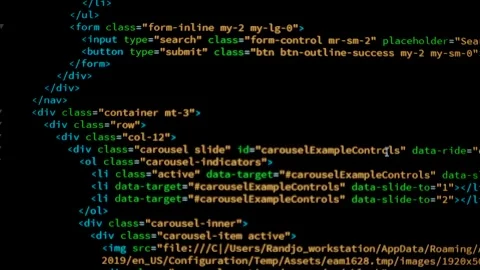 Developer is browsing html code on the computer screen. HTML Web Page Code Stock Footage 141018389