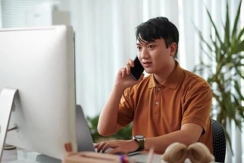Developer Calling Coworker Stock Photos