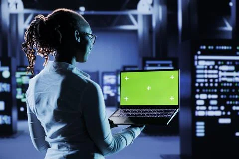 Developer codes on green screen laptop Stock Photos