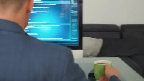 Developer codes intensely, taking coffee break to stay productive. Stock Footage 294299044