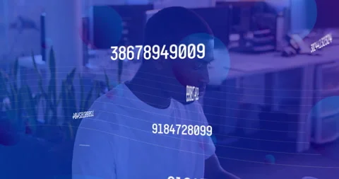 Developer coding at desk in tech office, projecting floating numeric codes and Stock Footage 307450296