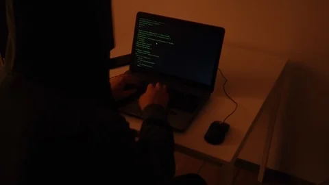 Developer coding the first artificial intelligence on laptop Stock Footage 120616777