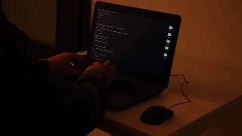 Developer coding the first artificial intelligence on laptop Stock Footage 120617136