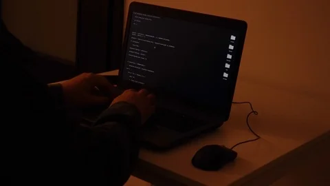 Developer coding the first artificial intelligence on laptop Stock Footage 120617286