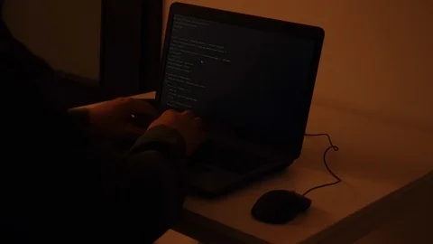 Developer coding the first artificial intelligence on laptop Stock Footage 120617300