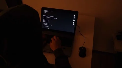 Developer coding the first artificial intelligence on laptop Stock Footage 120617550