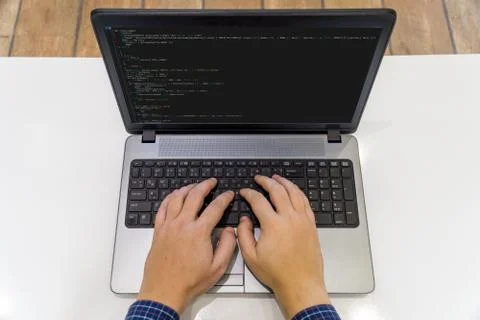 Developer coding on a laptop - top view Stockfoto's