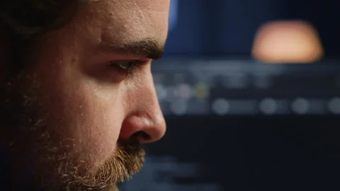 Developer concentrating hard while doing coding, extreme close up shot Stock Footage 265340579