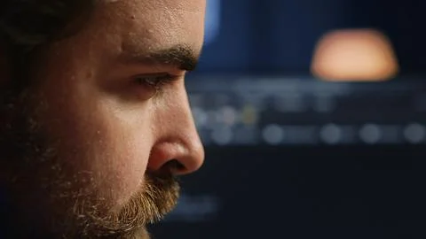 Developer concentrating hard while doing coding, extreme close up shot Stock Photos