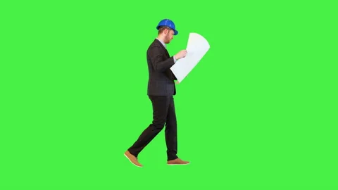 Developer on construction: architect engineer walk reading blueprint and Stock Footage 157978287