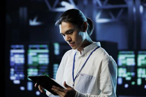 Developer in data center with tablet 写真素材