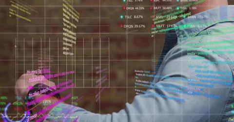 Developer in denim shirt manipulating code panels at brick wall, with holograms, 스톡 사진