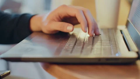 Developer diligently working under glowing monitor. Focused developer rapidly Stock Footage 333318832