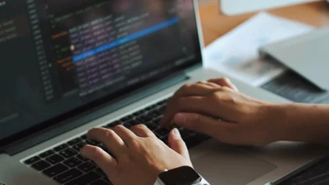 Developer Doing Coding, typing code on screen programmers coding internet 库存影片 334586017
