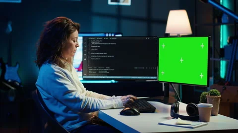 Developer doing software debugging on green screen PC at home Stock Footage 283594721