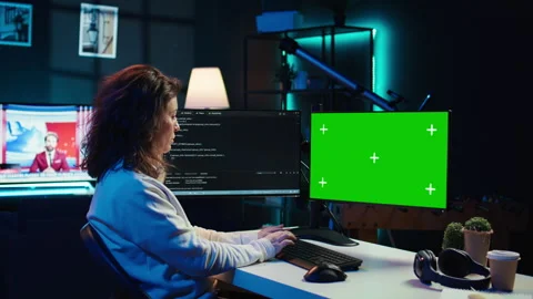 Developer doing software debugging on green screen PC at home Stock Footage 283690704