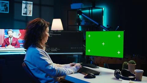 Developer doing software debugging on green screen PC at home Stock Photos