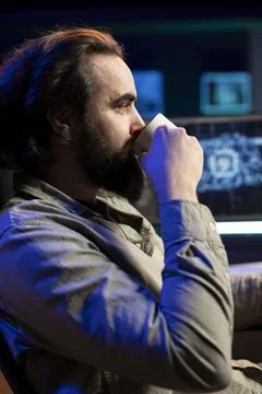 Developer drinking coffee updating artificial intelligence machine learning Stock Photos