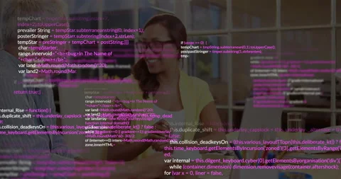 Developer duo collaborating on software at desk with laptop showing floating Stock Footage 307436159