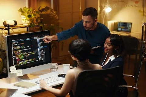 Developer Explaining Details in Code 写真素材