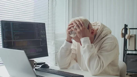 Developer Feeling Stressed Working with Coding Scripts on Computer at Office Stock Footage 303559374