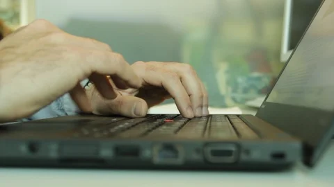 Developer hands working on laptop without mouse uses trackpad in his cubicle Video stock 85760919