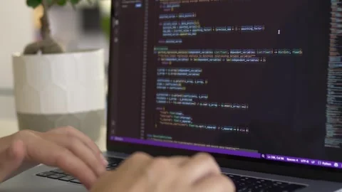 Developer interacting with command line code on laptop screen. Vibe coding, AI Видео 345654474