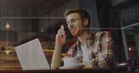 Developer with laptop holding smartphone to ear overlaying code tapping phone Stock Footage 318544607