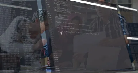 Developer leaning over table holding coffee and reviewing code overlay with UX Stock Footage 307440021