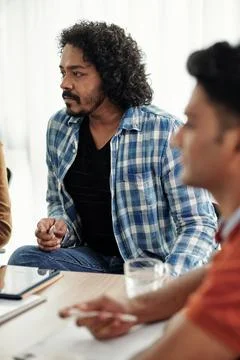 Developer Listening to Ideas of Coworker Stock Photos