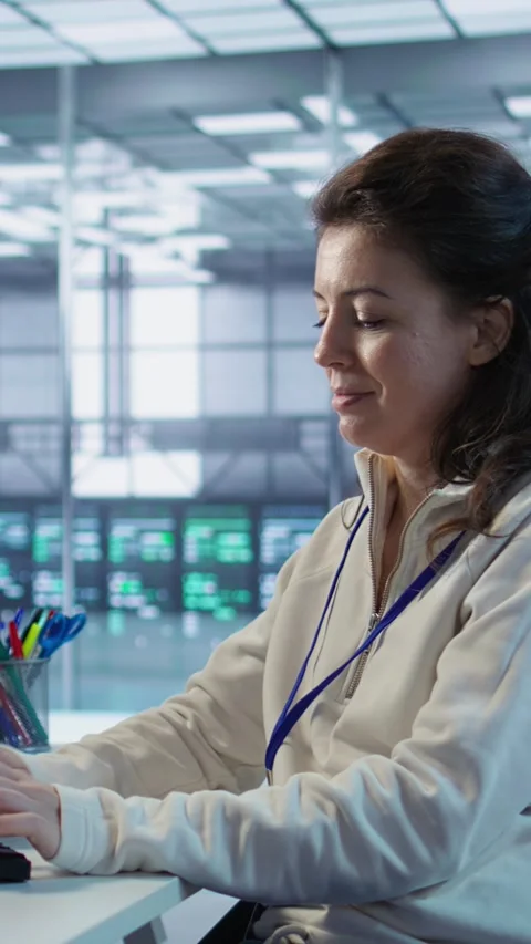 Developer listening music while programming in AI data center 스톡 동영상 319544073