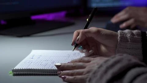 Developer logs bugs. Examining stack traces with meticulous documentation and Stock Photos