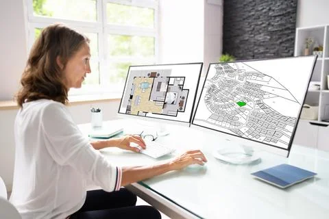 Developer Looking At Land Plot Map Fotos de archivo