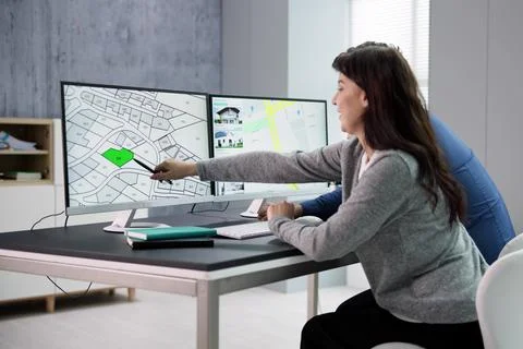 Developer Looking At Land Plot Map Fotos de archivo