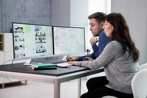 Developer Looking At Land Plot Map Fotos de archivo