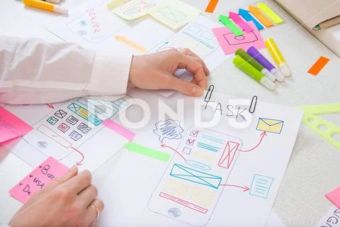 Developer makes paper prototype interface modern app Stock Photos