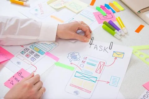 Developer makes paper prototype interface modern app Stock Photos