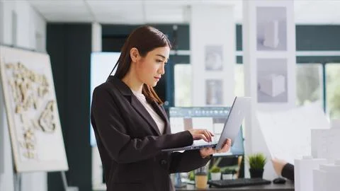 Developer makes sketches on laptop for construction program Foto stock