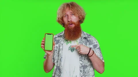 Developer man guy hold smartphone with green screen chroma key mock up recommend Stock Footage 252836850