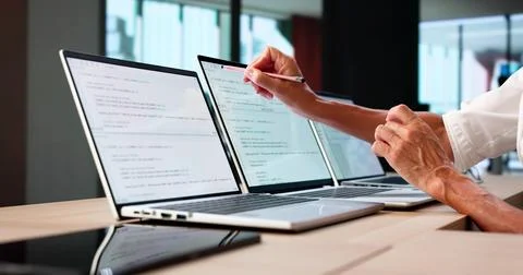 Developer Office: Coding And Developing Software On Computer Screens Stock Photos