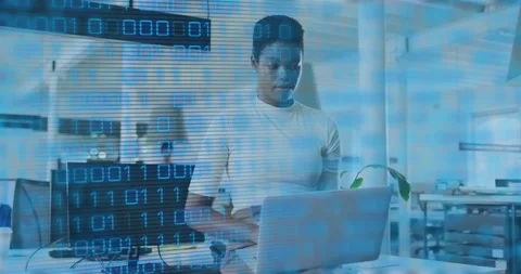 Developer opening laptop and typing code in office, causing binary overlay Stock Footage 315598551
