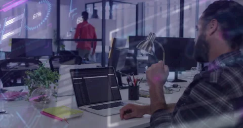 Developer pausing code in technology office, gesturing at desk lamp updating AR Stock Footage 311454684