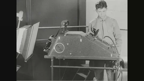 Developer places paper inside B7 printer for the black photographs - 1940 Stock Footage 107698553