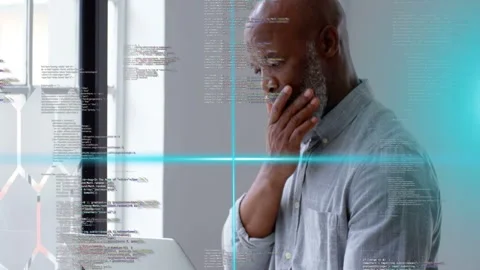 Developer placing laptop and typing at window, activating cyan HUD and debugging Stock Footage 332981681